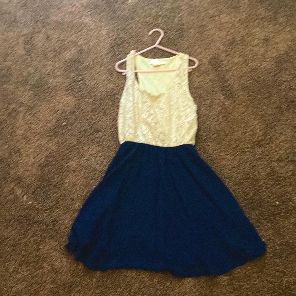 This is a white and blue dress. This dress is from A’GACI A’GACI A’GACI.